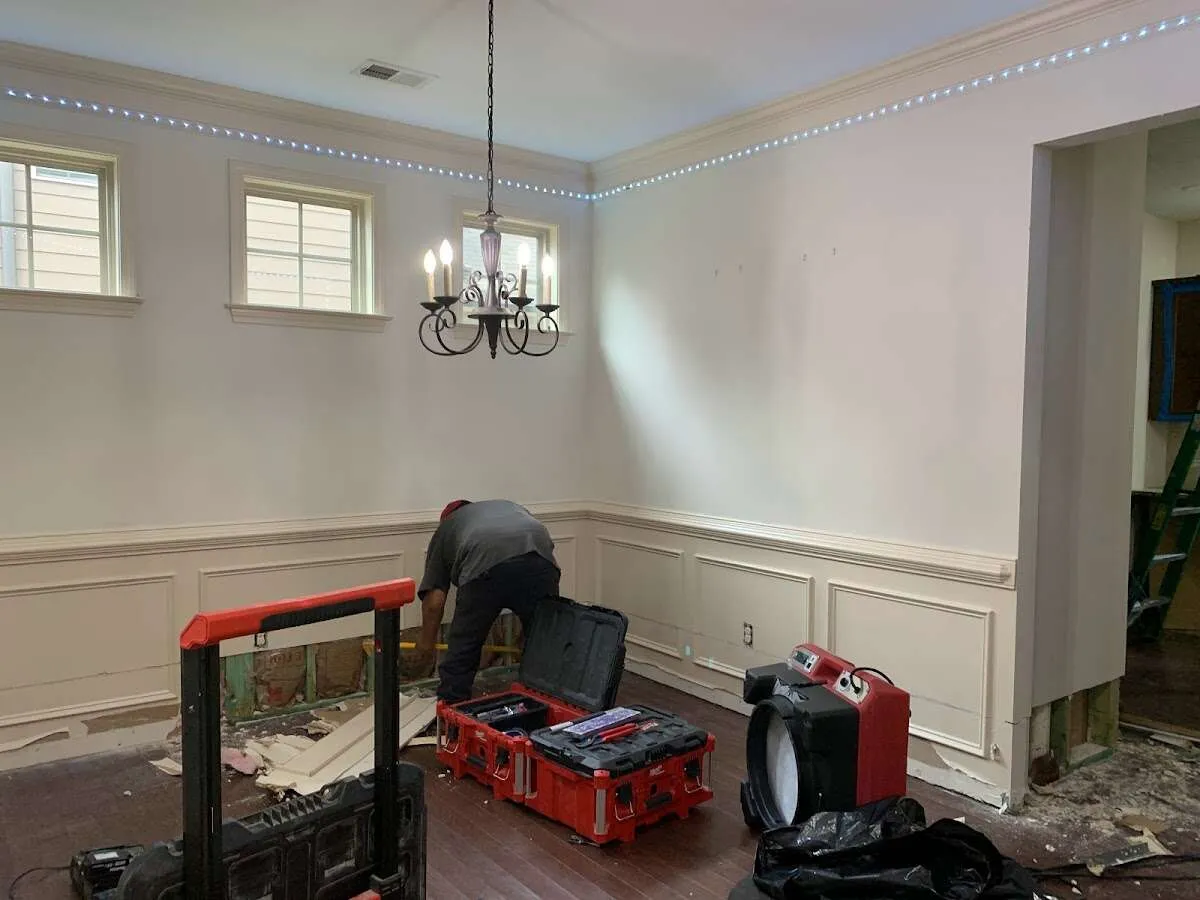 Restoration technician with professional equipment in Troy